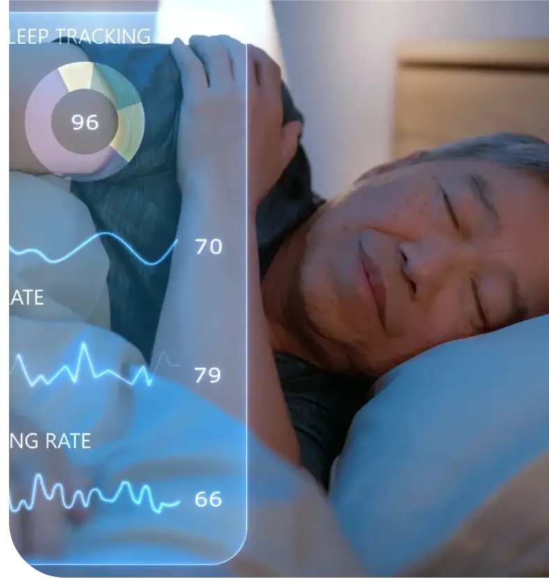 A person sleeping next to a health monitoring device showing vital signs.